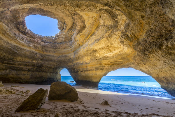 The sea caves of Benagil with natural windows on the clear waters of the Atlantic Ocean Faro District Algarve Portugal Europe