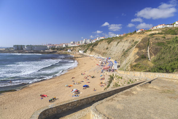 Top view of the village of Ericeira with the ocean waves crashing on the touristic sandy beach Mafra Portugal Europe
