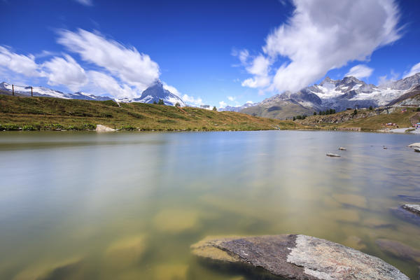 Lake Leisee frames the Matterhorn and the high peaks in the background in summer Zermatt Canton of Valais Switzerland Europe