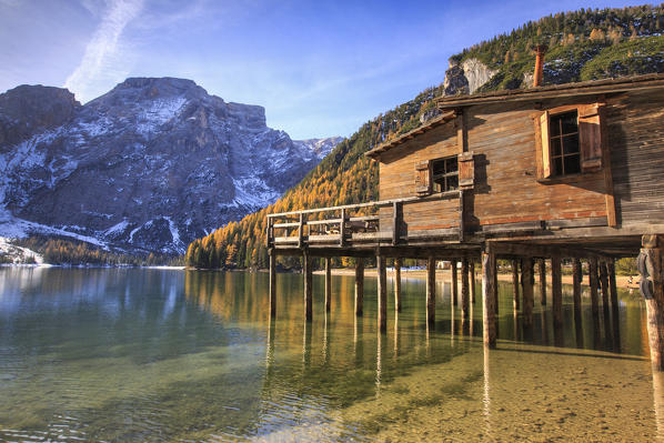 Wooden hut in the autumn landscape of Lake Braies Natural Park of Fanes Sennes Bolzano Trentino Alto Adige Italy Europe