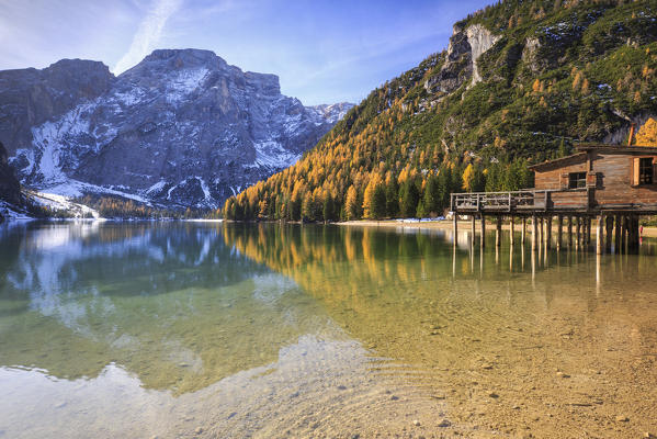 Colorful woods and peaks are reflected in Lake Braies Natural Park of Fanes Sennes Bolzano Trentino Alto Adige Italy Europe