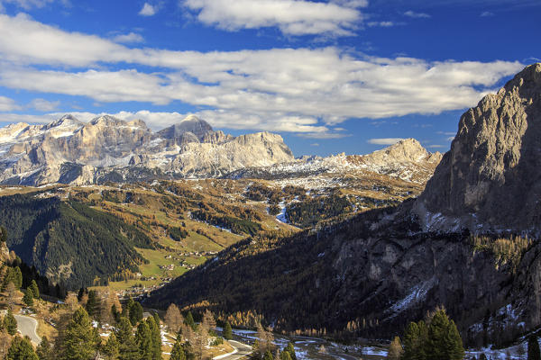 The colorful woods frame the landscape and the high peaks in autumn Gardena Pass South Tyrol Trentino Alto Adige Italy Europe