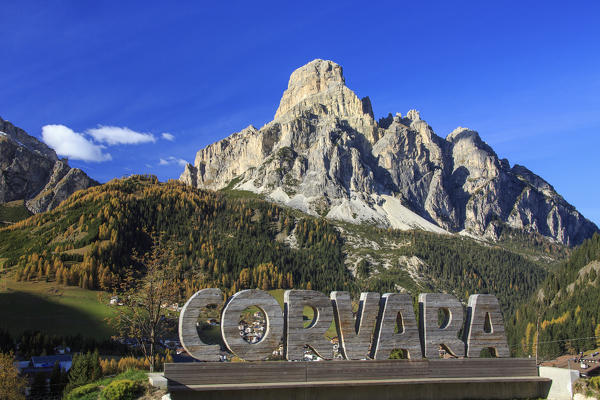 The colorful woods frame the village of Corvara and the high peaks Badia Valley South Tyrol Trentino Alto Adige Italy Europe