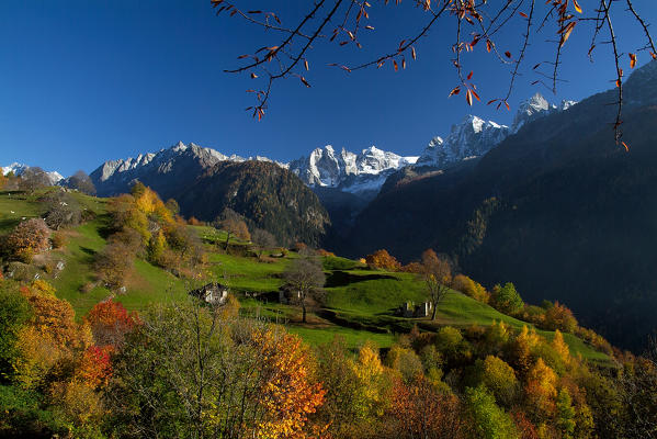 Autumn near the village of Soglio and the peaks of Bondasca Valley. Switzerland Europe