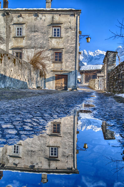 Reflections in the centre of the village of Soglio. Bregaglia Valley. Switzerland Europe