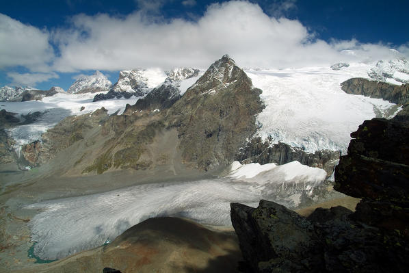 The tongue of the Fellaria glacier relaxing on a plateau in the heart of the Bernina group. Valmalenco. Valtellina Lombardy. Italy Europe