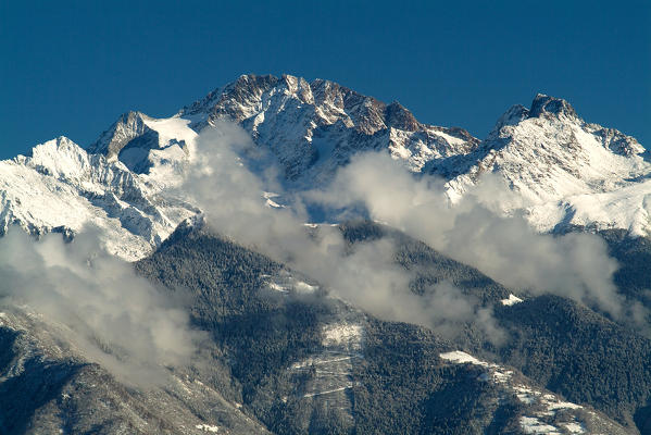 Mount Disgrazia and the peaks surrounding it capped by a winter snowfall. Valmasino. Valtellina. Lombardy. Europe