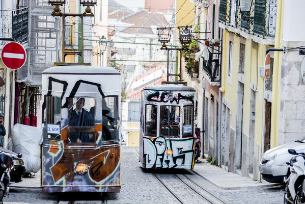 The characteristic trams proceed towards Bairro Alto a central district of the old city of Lisbon Portugal Europe