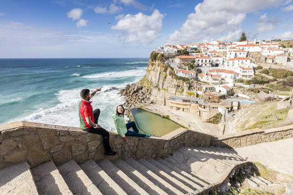 Tourists admire the perched village of Azenhas do Mar overlooking the Atlantic Ocean Sintra Portugal Europe