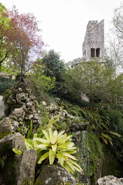 Old mystical tower of Romanesque Gothic and Renaissance style inside the park Quinta da Regaleira Sintra Portugal Europe