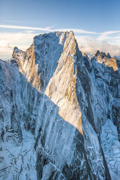 Aerial shot of the north face of Piz Badile located between Masino and Bregaglia Valley border Italy Switzerland Europe