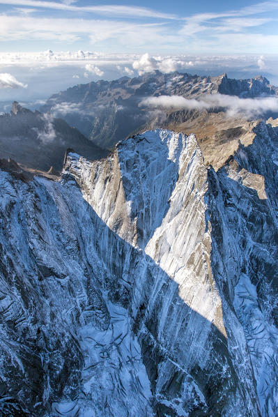 Aerial shot of the north face of Piz Badile located between Masino and Bregaglia Valley border Italy Switzerland Europe