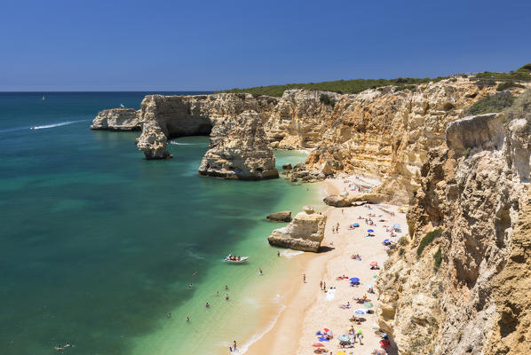 Top view of cliffs and turquoise water of the ocean Praia da Marinha Caramujeira Lagoa Municipality Algarve Portugal Europe