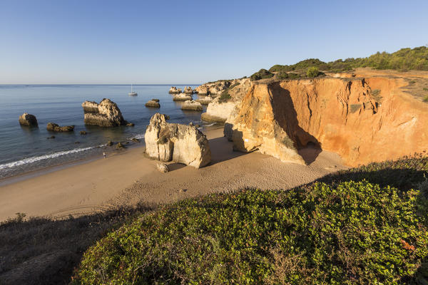 Top view of the sandy beach bathed by the blue ocean at dawn Praia do Alemao Portimao Faro district Algarve Portugal Europe