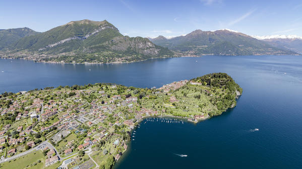 Aerial view of the village of Bellagio frames by the blue Lake Como and snowy peaks in background Lombardy Italy Europe