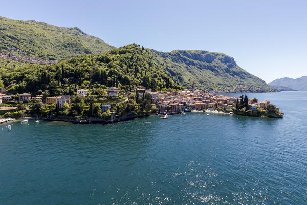 Aerial view of Varenna frames by the blue water of Lake Como on a sunny spring day Lecco Province Lombardy Italy Europe