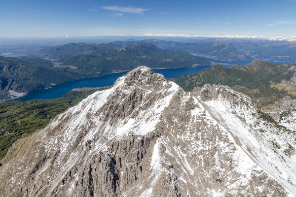 Aerial view of the snowy ridges of the Grignetta mountain with Lake Como in the background Lecco Province Lombardy Italy Europe