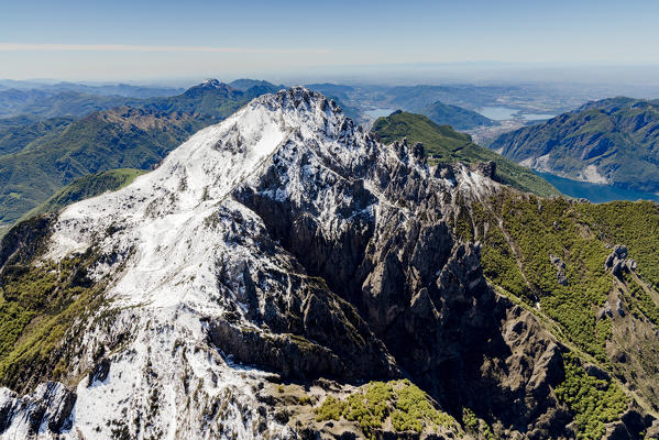 Aerial view of the snowy ridges of Grignetta and Resegone with the lake in the background Lecco Province Lombardy Italy Europe