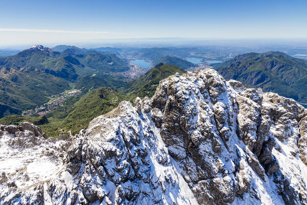 Aerial view of the snowy ridges of Grignetta and Resegone with the lake in the background Lecco Province Lombardy Italy Europe