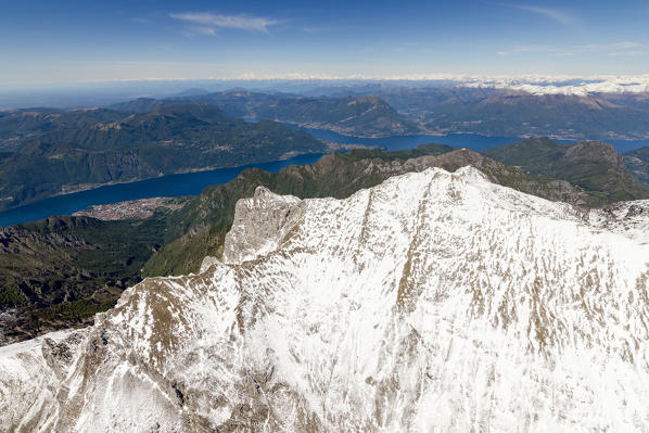 Aerial view of the snowy ridges of the Grignone mountain with Lake Como in the background Lecco Province Lombardy Italy Europe