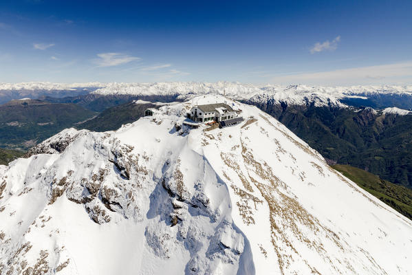 Aerial view of snowy peaks of Grignone with Brioschi Refuge on the summit  Lecco Province Lombardy Italy Europe