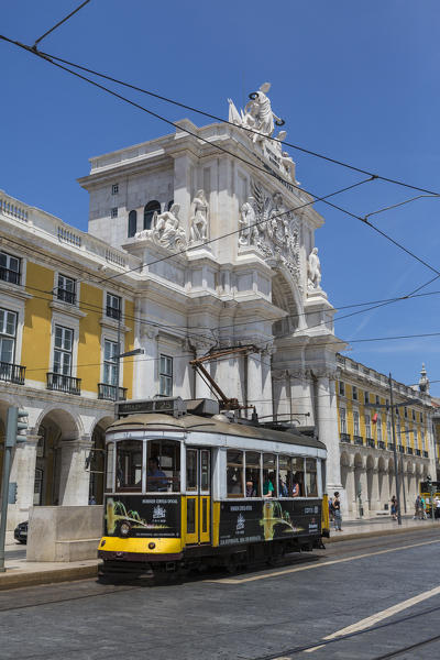 A typical tram passes by the historical Praca Do Comercio square near the Tagus river Lisbon Estremadura Portugal Europe