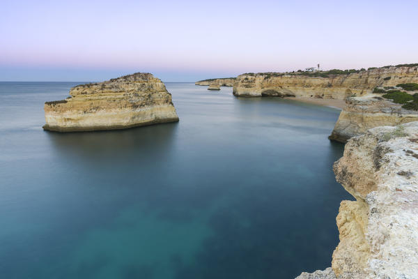 Top View of cliffs and turquoise water of Praia De Albandeira Carvoeiro Caramujeira Lagoa Municipality Algarve Portugal Europe