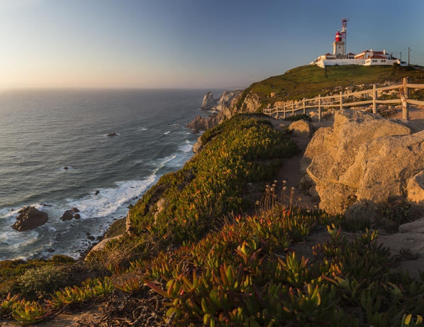Panoramic view of the cape and lighthouse of Cabo da Roca overlooking the Atlantic Ocean at sunset Sintra Portugal Europe
