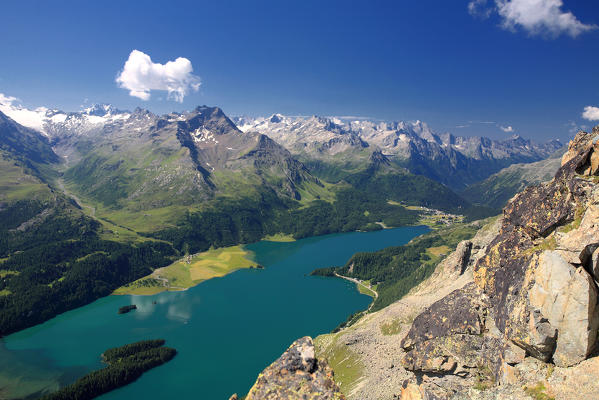 The lake of Sils seen by piz Lagrev, in the background piz de la Margna, on the left Val di fex and on the right Maloja Pass, Engadine, Switzerland Europe