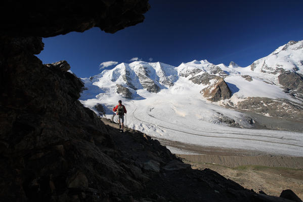 Going down from Munt Pers, very close to Diavolezza refuge, the trekking-lovers con enjoy the view of the big Pers glacier and of the Morteratsch glacier. High Engadine, Switzerland Europe