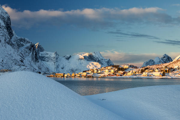 The blue color of dusk on the fishing village and the snowy peaks Kvalvika Andøya Reine Nordland Lofoten Islands Norway Europe