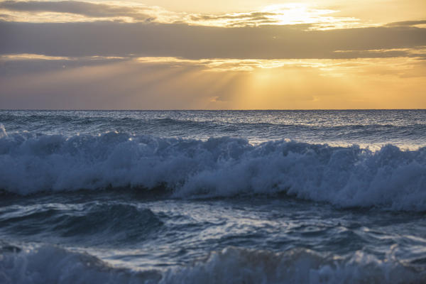 The wave moves toward the beach in the clear waters of the Caribbean Sea Antigua and Barbuda Leeward Island West Indies