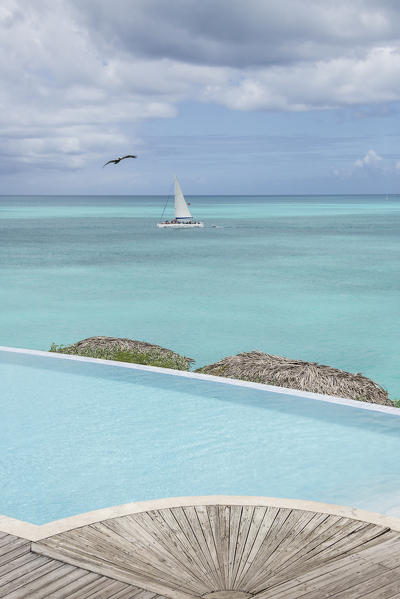 Pool in front of the turquoise waters of Caribbean Sea Ffryes Beach Sheer Rocks Antigua and Barbuda Leeward Island West Indies