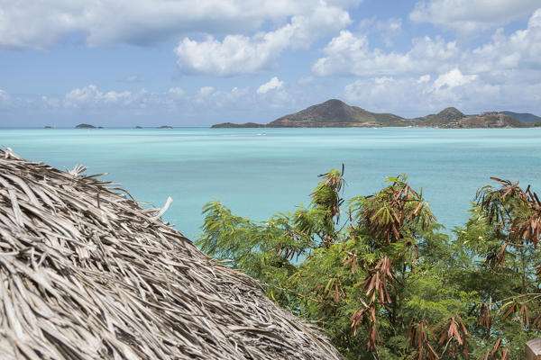 The turquoise waters of Caribbean Sea Ffryes Beach Sheer Rocks Antigua and Barbuda Leeward Island West Indies
