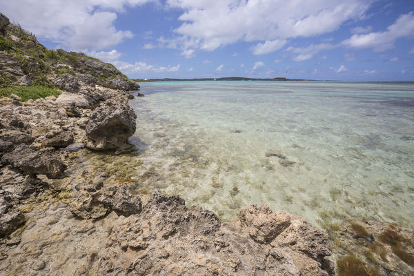 The turquoise shades of the Caribbean Sea seen from the cliffs of Green Island Antigua and Barbuda Leeward Island West Indies