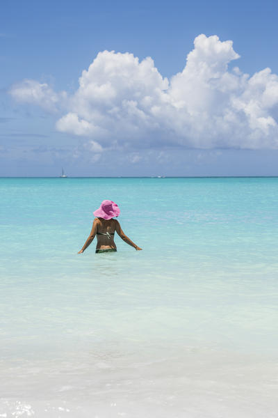 Bather in the turquoise waters of the Caribbean Sea Jolly Beach Antigua and Barbuda Leeward Island West Indies