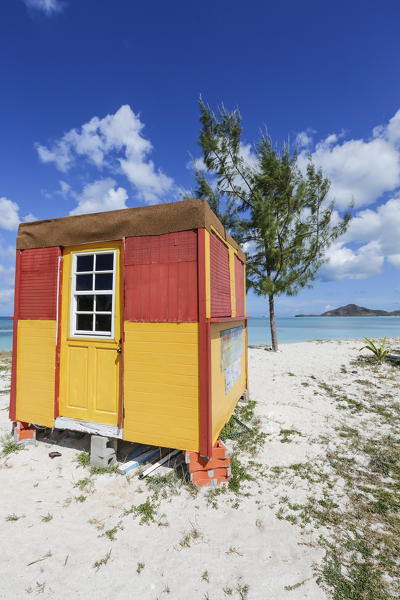 A colorful cabin frames the turquoise water of the Caribbean Sea Ffryers Beach Antigua and Barbuda Leeward Islands West Indies