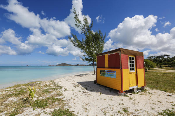 A colorful cabin frames the turquoise water of the Caribbean Sea Ffryers Beach Antigua and Barbuda Leeward Islands West Indies