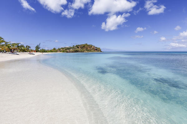 Palm trees and white sand surround the turquoise Caribbean sea Ffryers Beach Antigua and Barbuda Leeward Islands West Indies