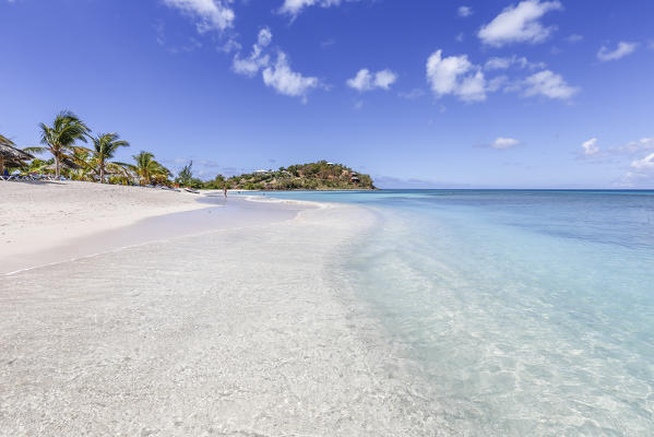 Palm trees and white sand surround the turquoise Caribbean sea Ffryers Beach Antigua and Barbuda Leeward Islands West Indies