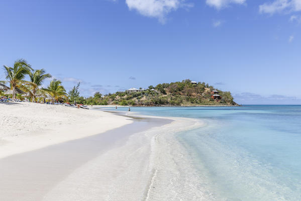 Palm trees and white sand surround the turquoise Caribbean sea Ffryers Beach Antigua and Barbuda Leeward Islands West Indies
