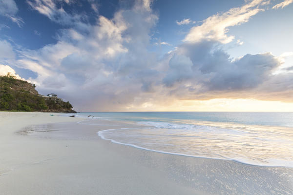 The sky turns pink at sunset and reflected on Ffryers Beach Caribbean Antigua and Barbuda Leeward Islands West Indies