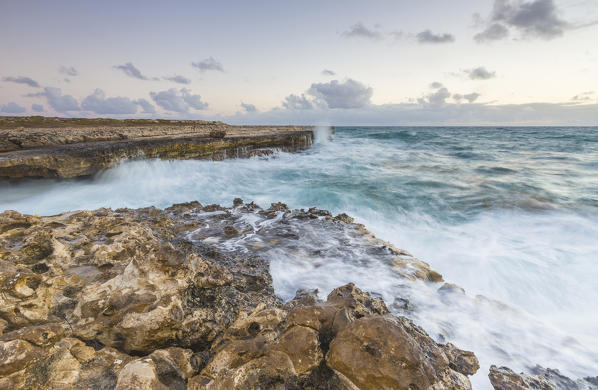 Waves of the rough sea crashing on the  cliffs of Devil's Bridge Caribbean Antigua and Barbuda Leeward Islands West Indies