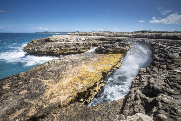 Waves in the natural arches of limestone carved by sea Devil's Bridge Caribbean Antigua and Barbuda Leeward Islands West Indies