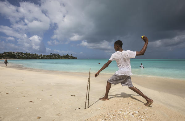 Kids playing on the beach surrounded by the turquoise Caribbean sea The Nest Antigua and Barbuda Leeward Islands West Indies