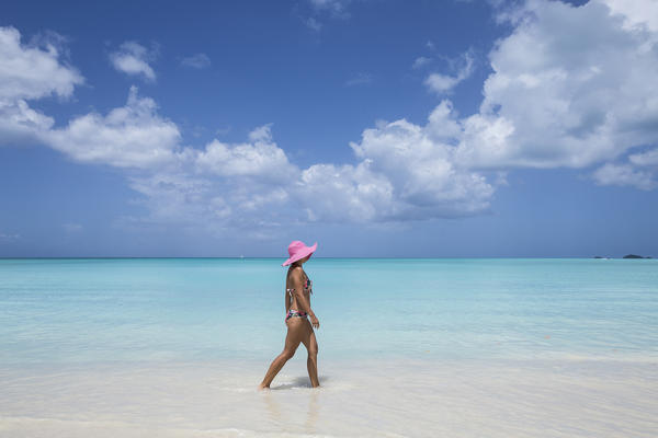 A walk on the beach lapped by the turquoise waters of Caribbean Sea The Nest Antigua and Barbuda Leeward Islands West Indies