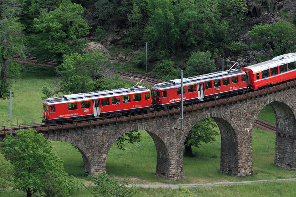The Bernina Express on the viaduct in Brusio, Val Poschiavo, Switzerland Europe