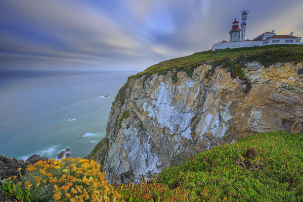 Sunrise on the cape and lighthouse of Cabo da Roca overlooking the Atlantic Ocean Sintra Portugal Europe