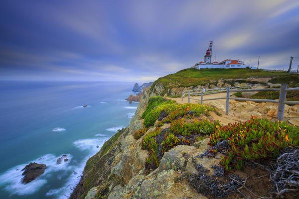 Sunrise on the cape and lighthouse of Cabo da Roca overlooking the Atlantic Ocean Sintra Portugal Europe