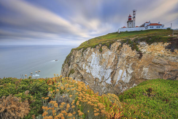 Sunrise on the cape and lighthouse of Cabo da Roca overlooking the Atlantic Ocean Sintra Portugal Europe